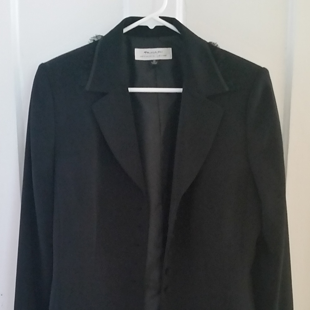 Black jacket with sheer ruffles on collar and cuff